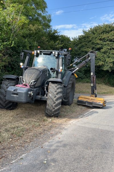 Tractor mounted side arm for verge mowing and hedge cutting